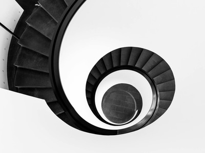Black and white abstract view of a spiral staircase in Nürnberg, Germany.